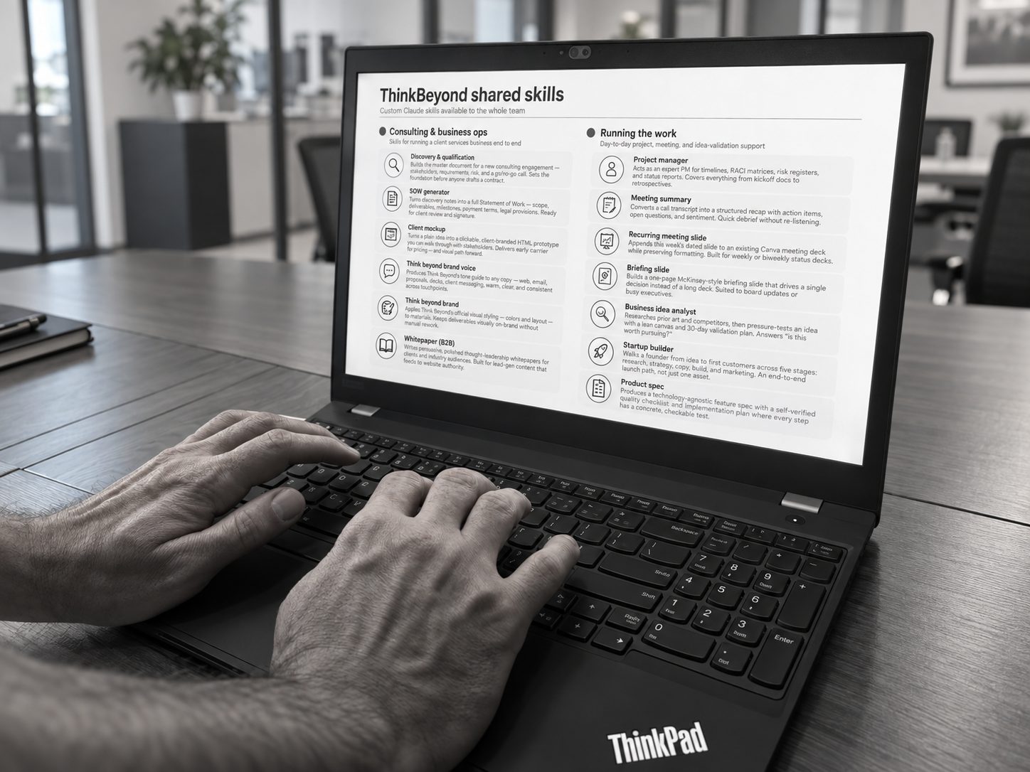 A Think Beyond team member using a custom shared-skills tool on a laptop